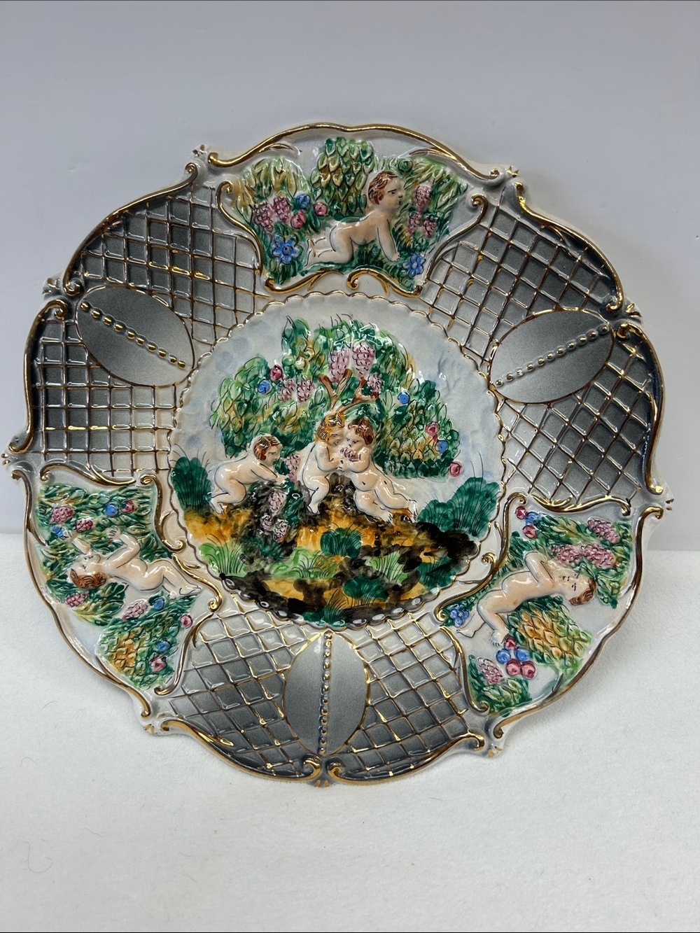 Vintage 70’s Capodimonte 13” porcelain hand painted /decorated cherub plate